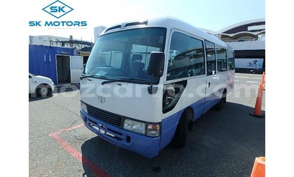Nunua Imported Toyota Coaster Nyeupe Gari ndani ya Import - Dubai nchini Cabo Delgado